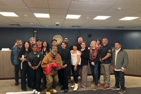 Members of the community, along with Councilmember Aurin Chowdhury (Ward 12), Councilmember Aisha Chughtai (Ward 10) and Councilmember Jason Chavez (Ward 9) stand alongside Chelsie Glaubitz (MRLF President) and Alfreda D. Juasemai (Executive Campaign Manager) in the Council chambers.
