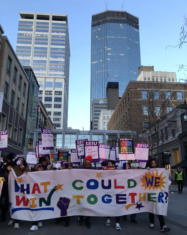 March with skyline as backdrop