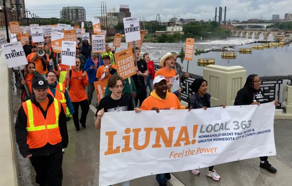 Ilhan Omar helps carry Local 363 banner