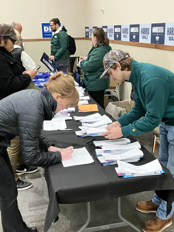 Volunteer picking up turf map